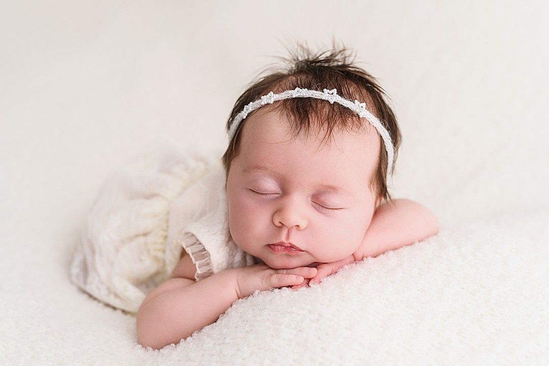 Timeless newborn portrait with baby lying on soft blankets – Dublin newborn photoshoot