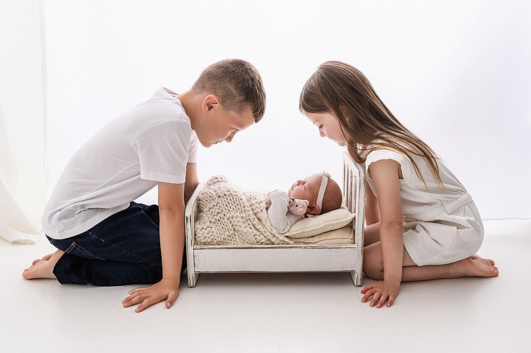 Newborn baby girl peacefully sleeping during a professional photoshoot in Dublin studio