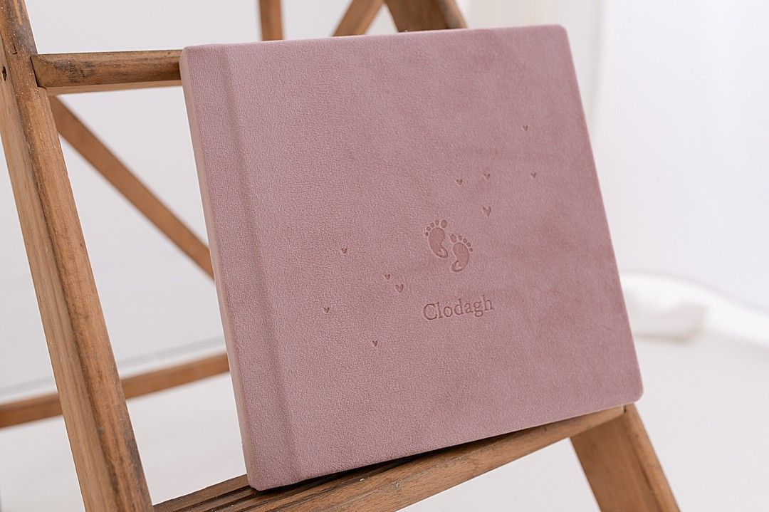 Pink velvet photo album with delicate floral accent from Dublin newborn photography studio
