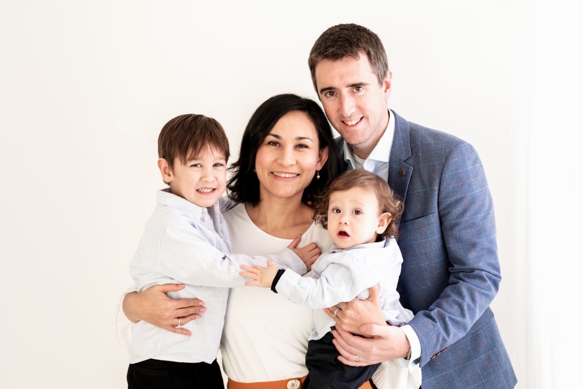 Portrait photograph featuring a family of four.