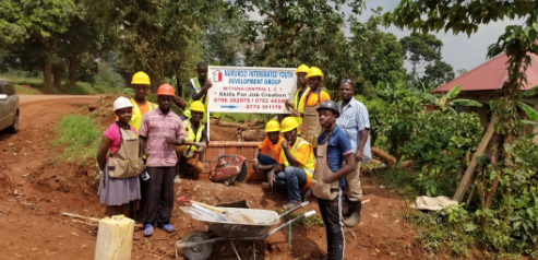 a group of people in hard hats