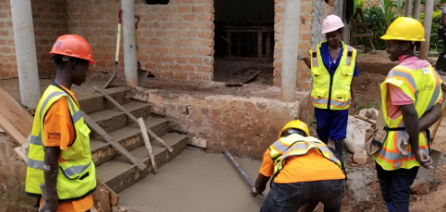 a group of people in hard hats