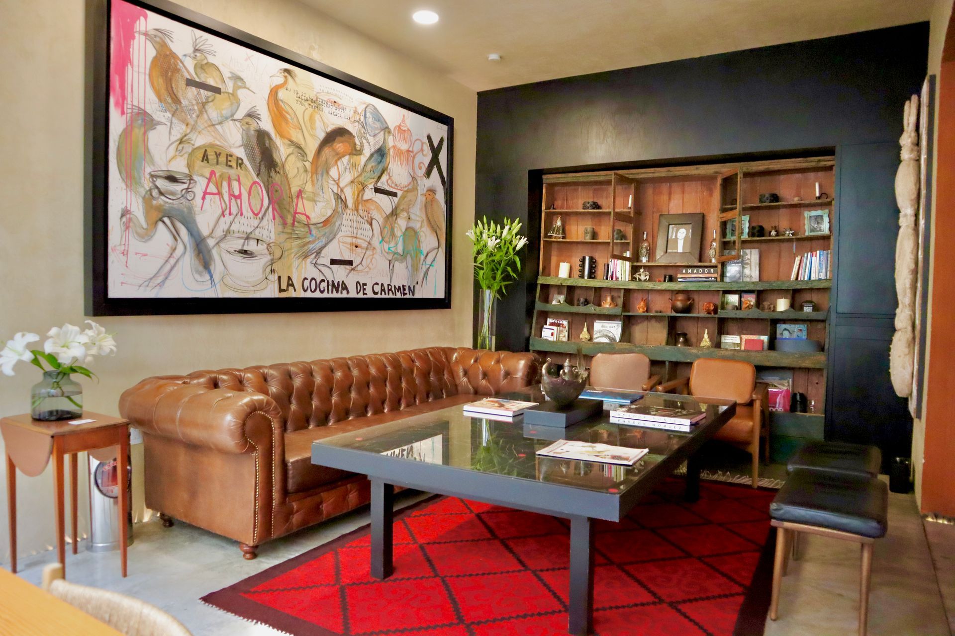 Bed with a wooden headboard, white pillows, and decorative accent pillows.