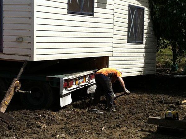 man preparing building to be moved