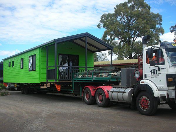 green building on truck