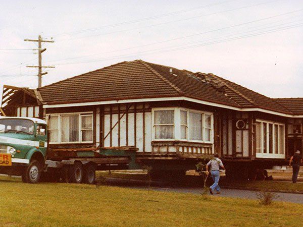 large vintage home being prepared to move