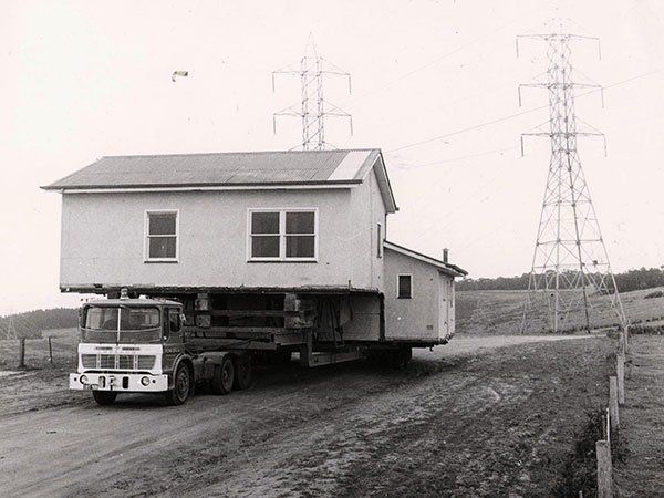 large home on vintage truck