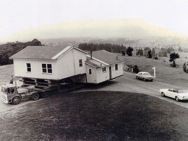 large vintage home on truck