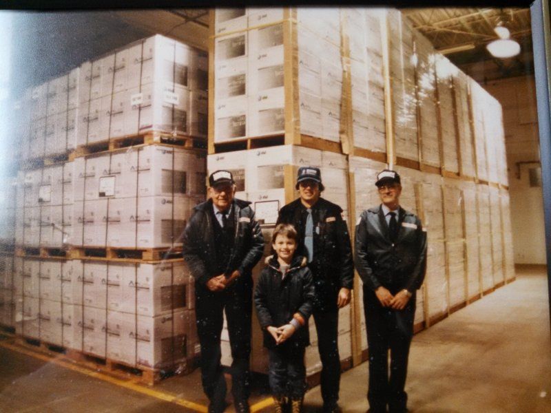 Young Joseph with crew at AT&T warehouse
