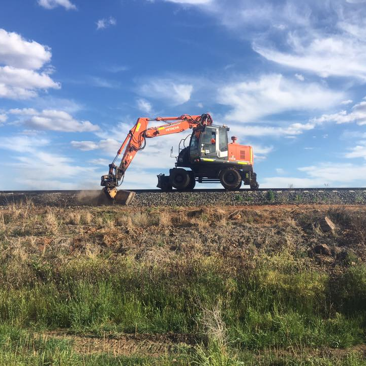 Orange Grader Truck Plowing Earth in Dubbo