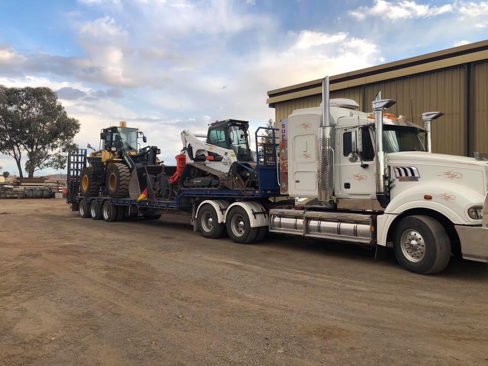 Truck loaded with two Machinery — Satts Plant Hire & Haulage in Wellington, NSW