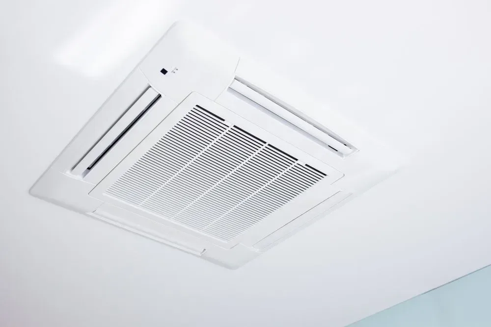 White Ceiling-mounted Air Conditioning Unit With a Grid Design — KACE Electrical Solutions In Ramsay, QLD