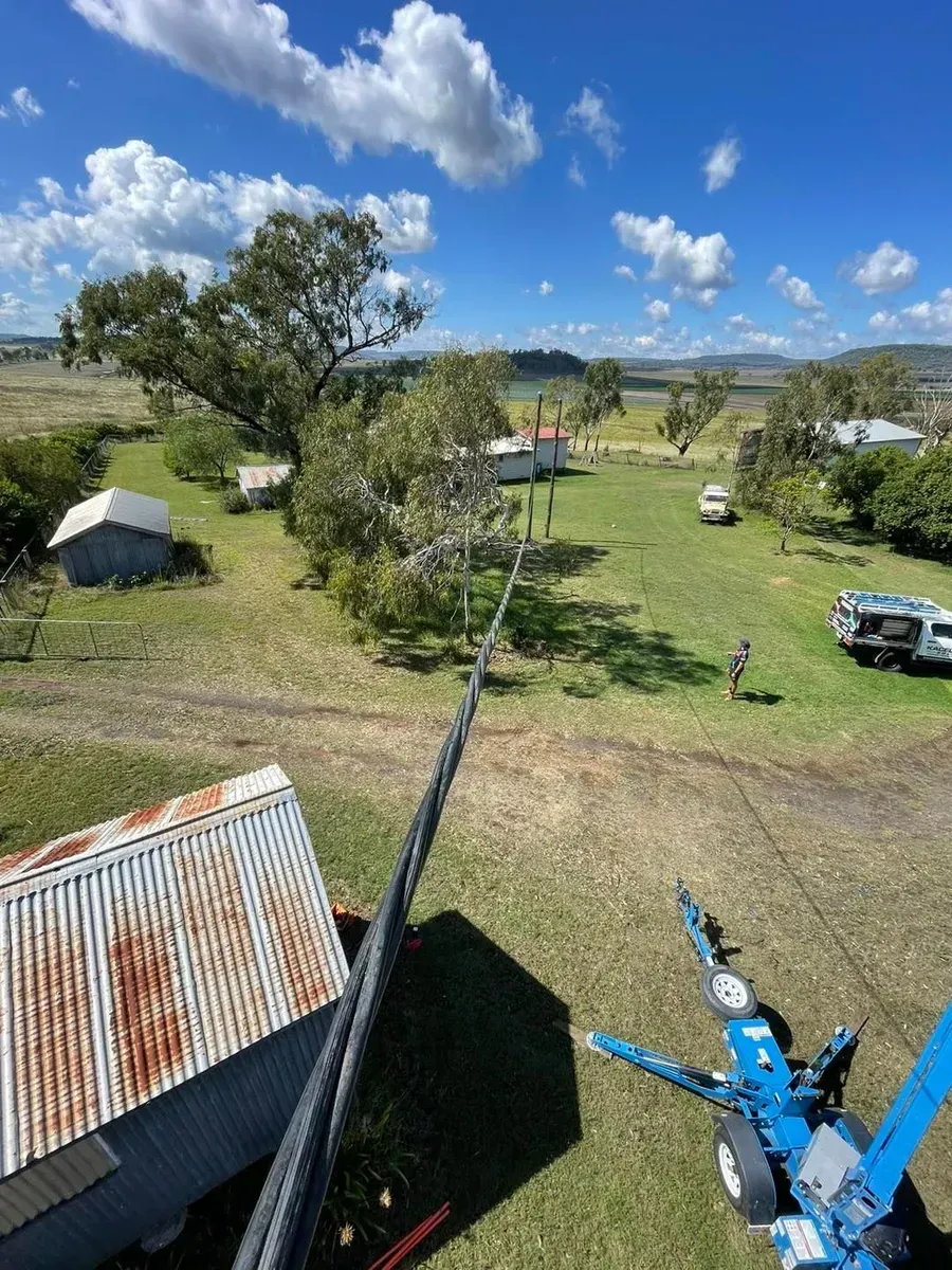View From a Lift of a Rural Scene With Houses, Trees, and Utility Lines — KACE Electrical Solutions In Ramsay, QLD
