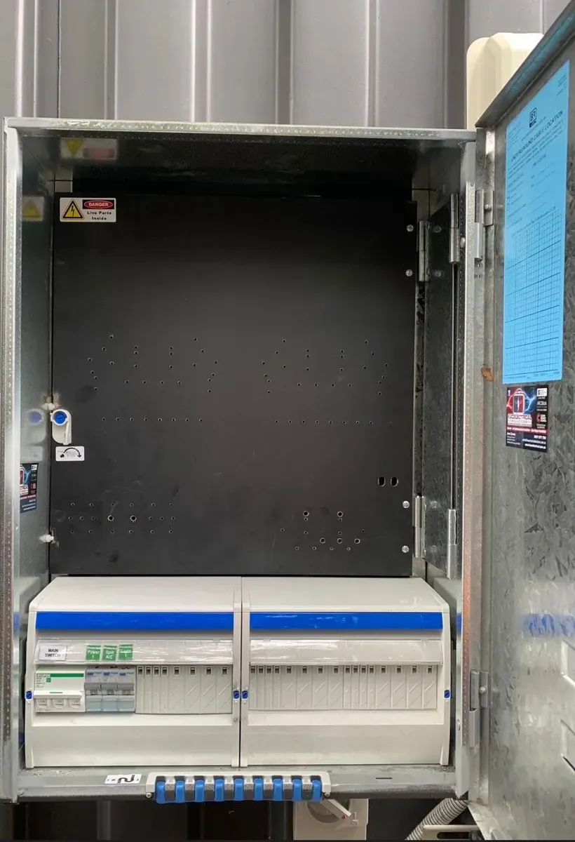 Electrical Panel With Blue and White Breakers Inside a Metal Cabinet — KACE Electrical Solutions In Ramsay, QLD