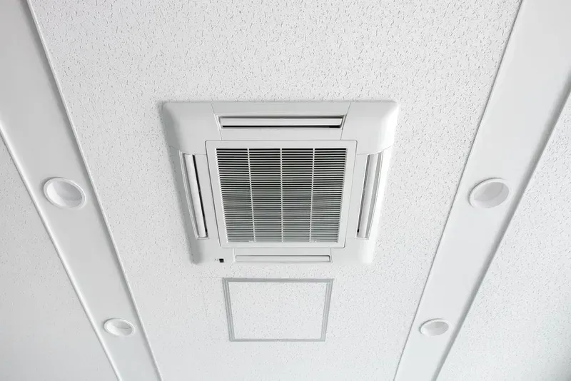 White Ceiling-mounted Air Conditioning Unit With a Vent — KACE Electrical Solutions In Dalby, QLD
