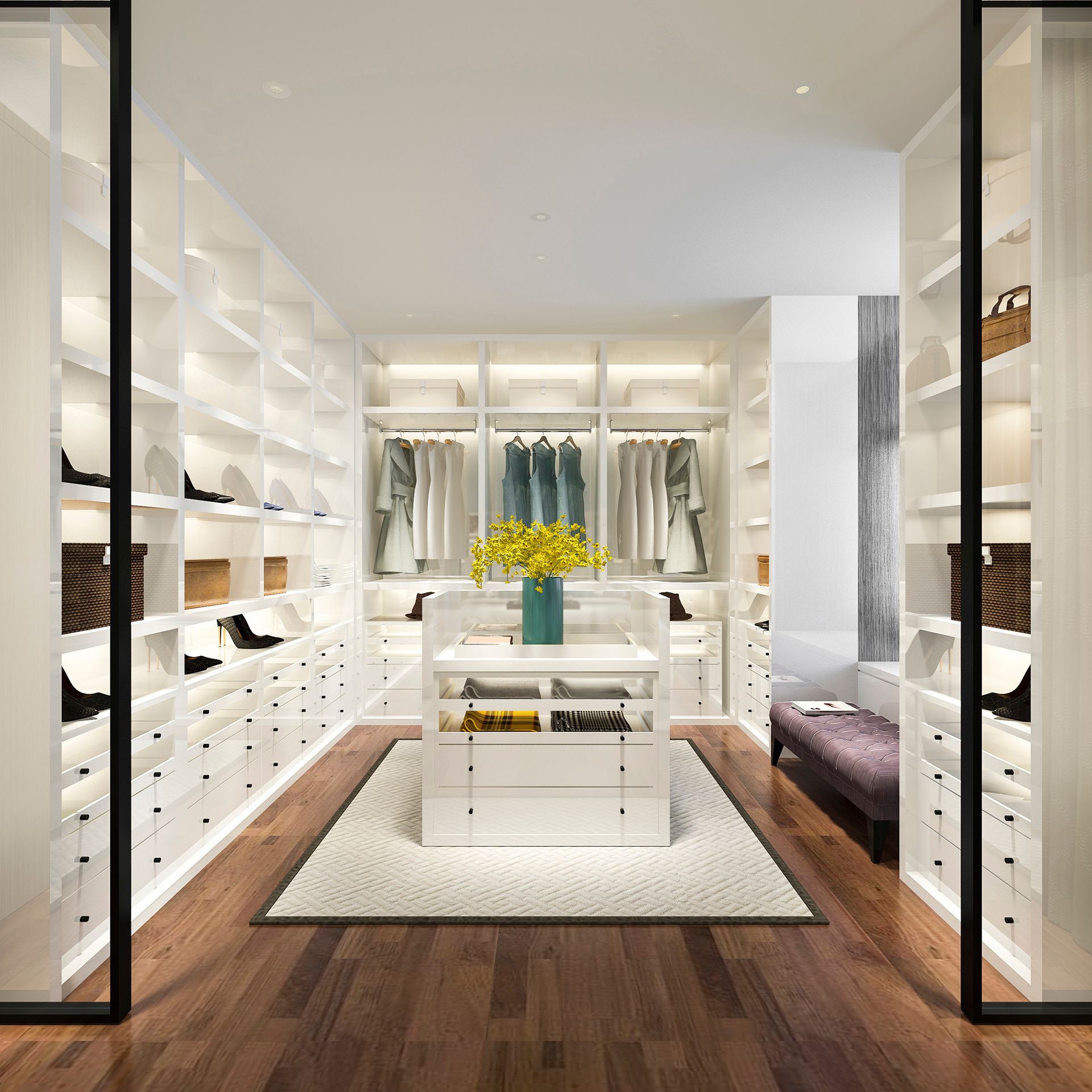 A walk in closet with a table in the middle