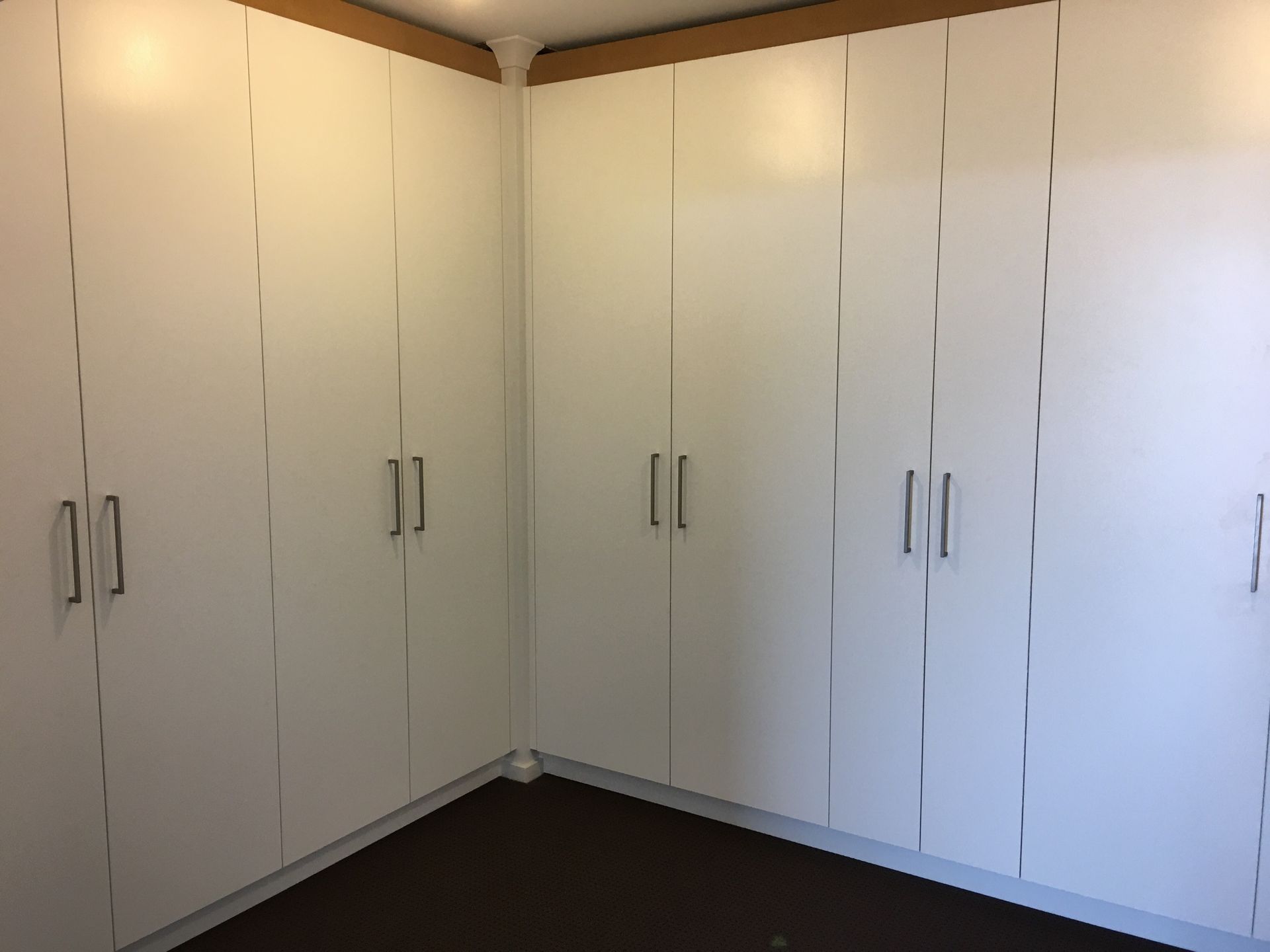 There are a lot of white cabinets in this room.