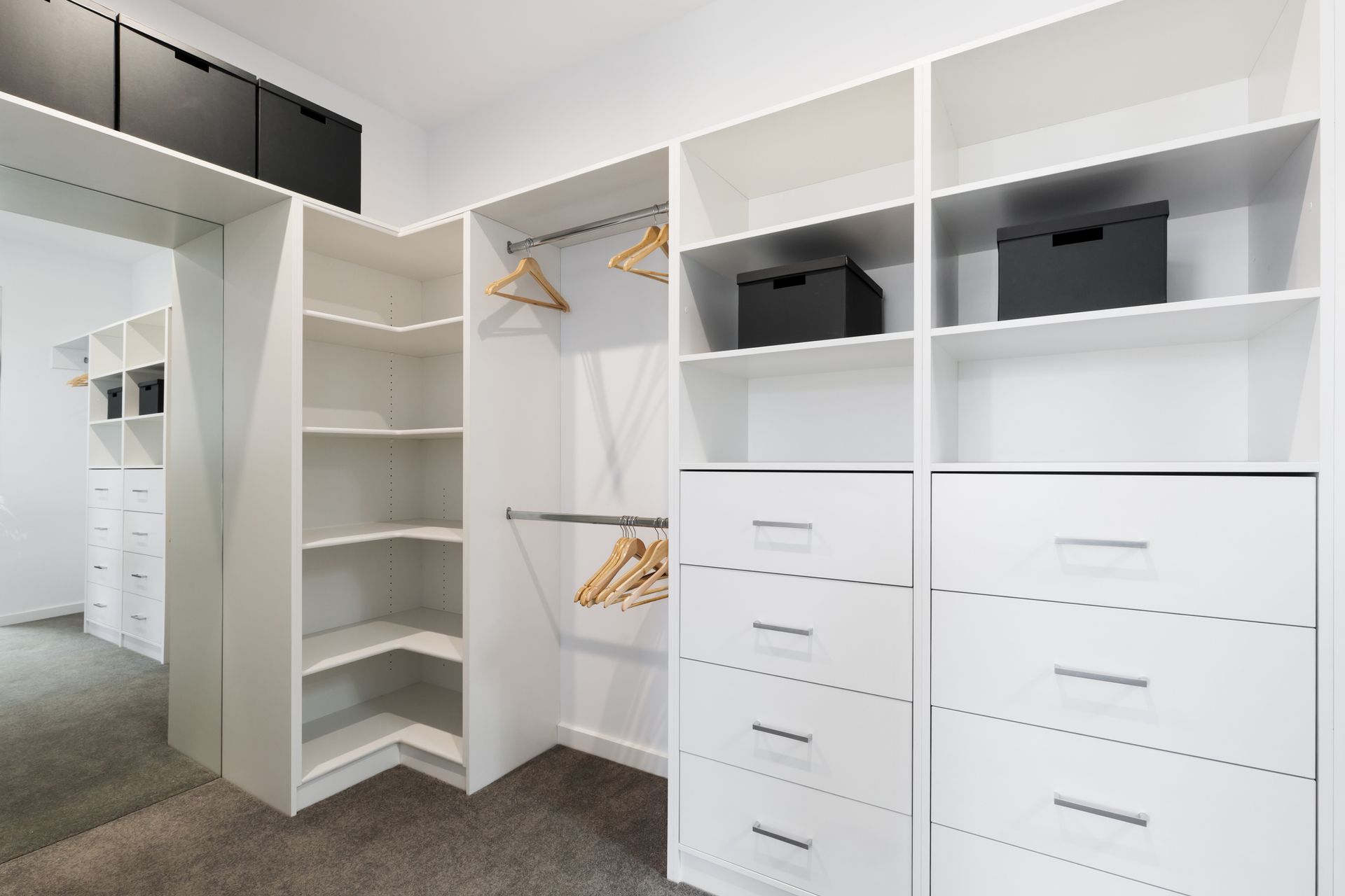 Spacious walk-in wardrobe with custom cabinetry for smart, stylish storage.
