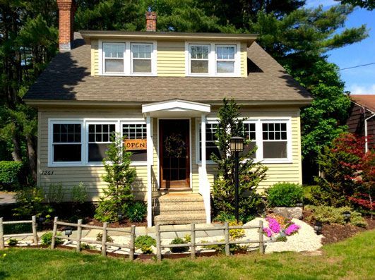 A house with a sign that says open on it
