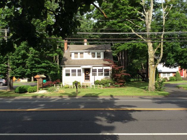 A house with a sign that says open on it