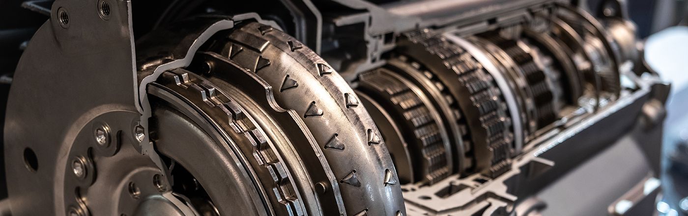 Cutaway view of an automatic transmission showing internal gears and components.