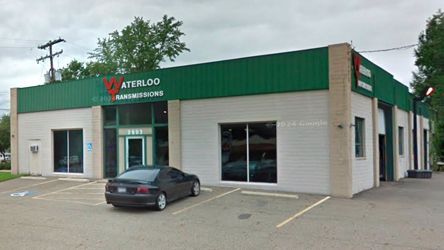 A car is parked in front of a building that says waterloo