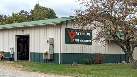 A building with a sign on the side that says waterloo transmissions