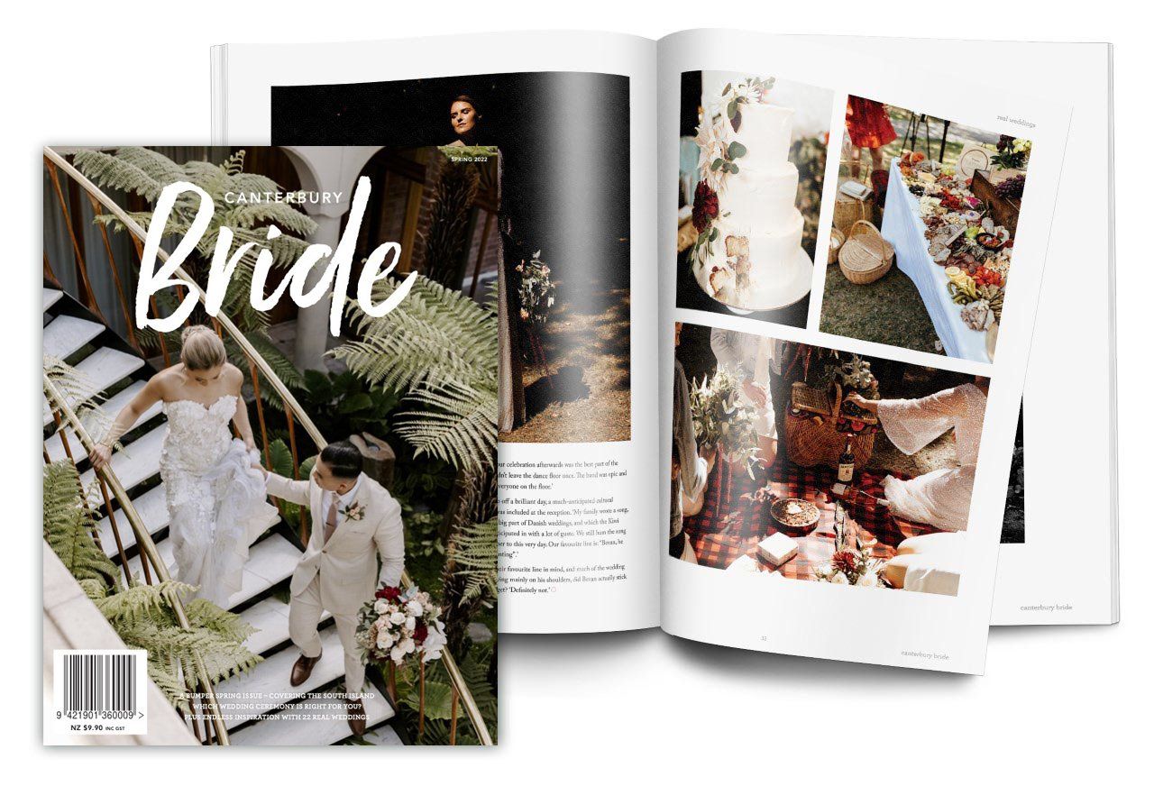 A bride and groom are walking down stairs in a magazine.