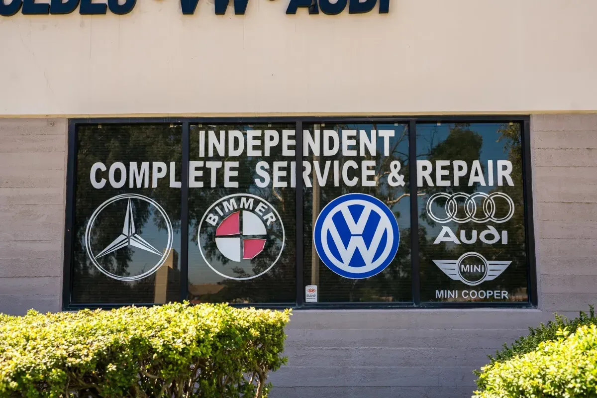 Storefront Window with Logos for Mercedes-Benz, BMW, Volkswagen, Audi, and MINI Cooper | Techstar European Car Masters