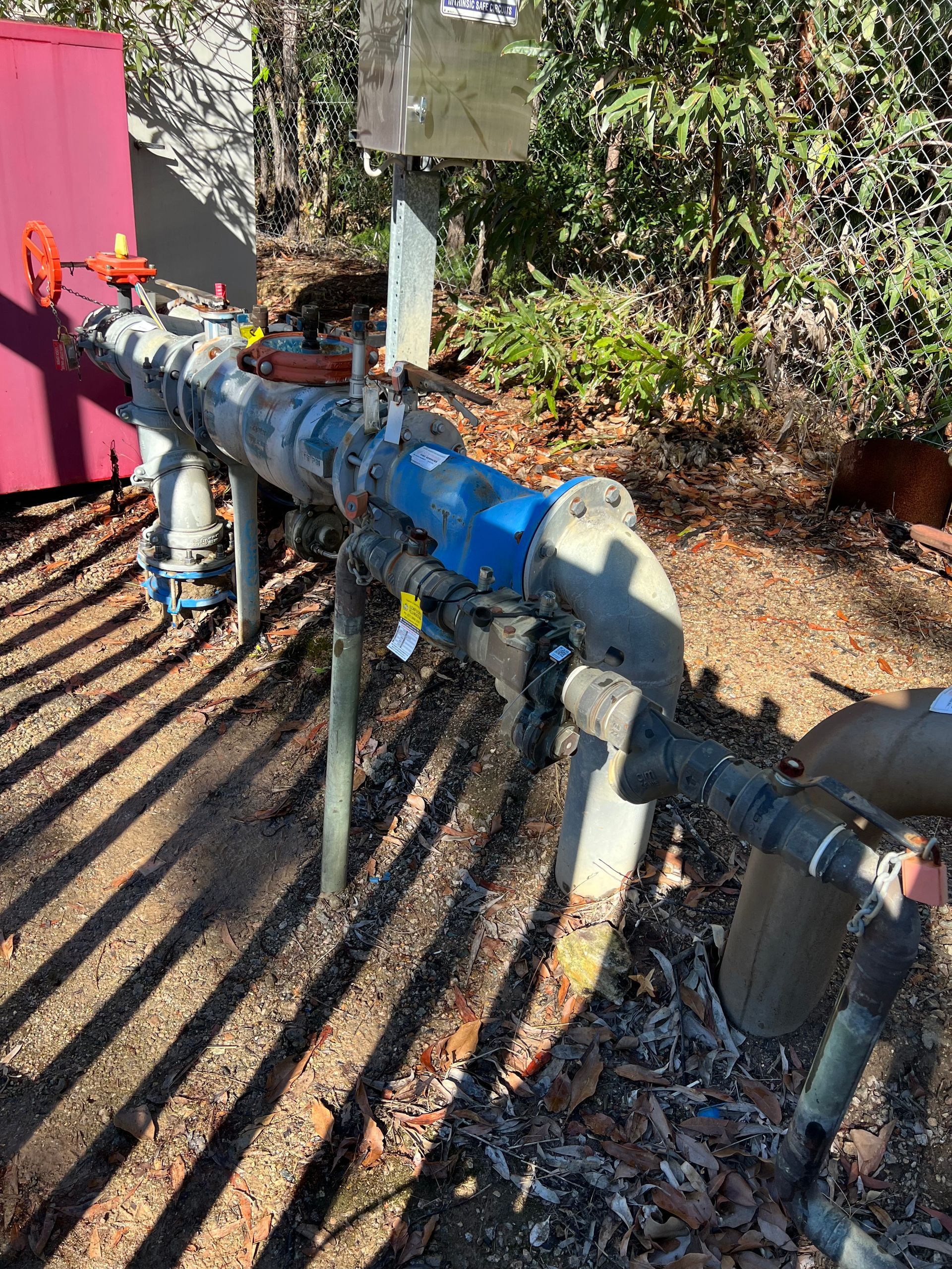 A Close Up of a Bunch of Blue Pipes and Valves — Simpson's Plumbing & Maintenance Service in Dakabin, QLD