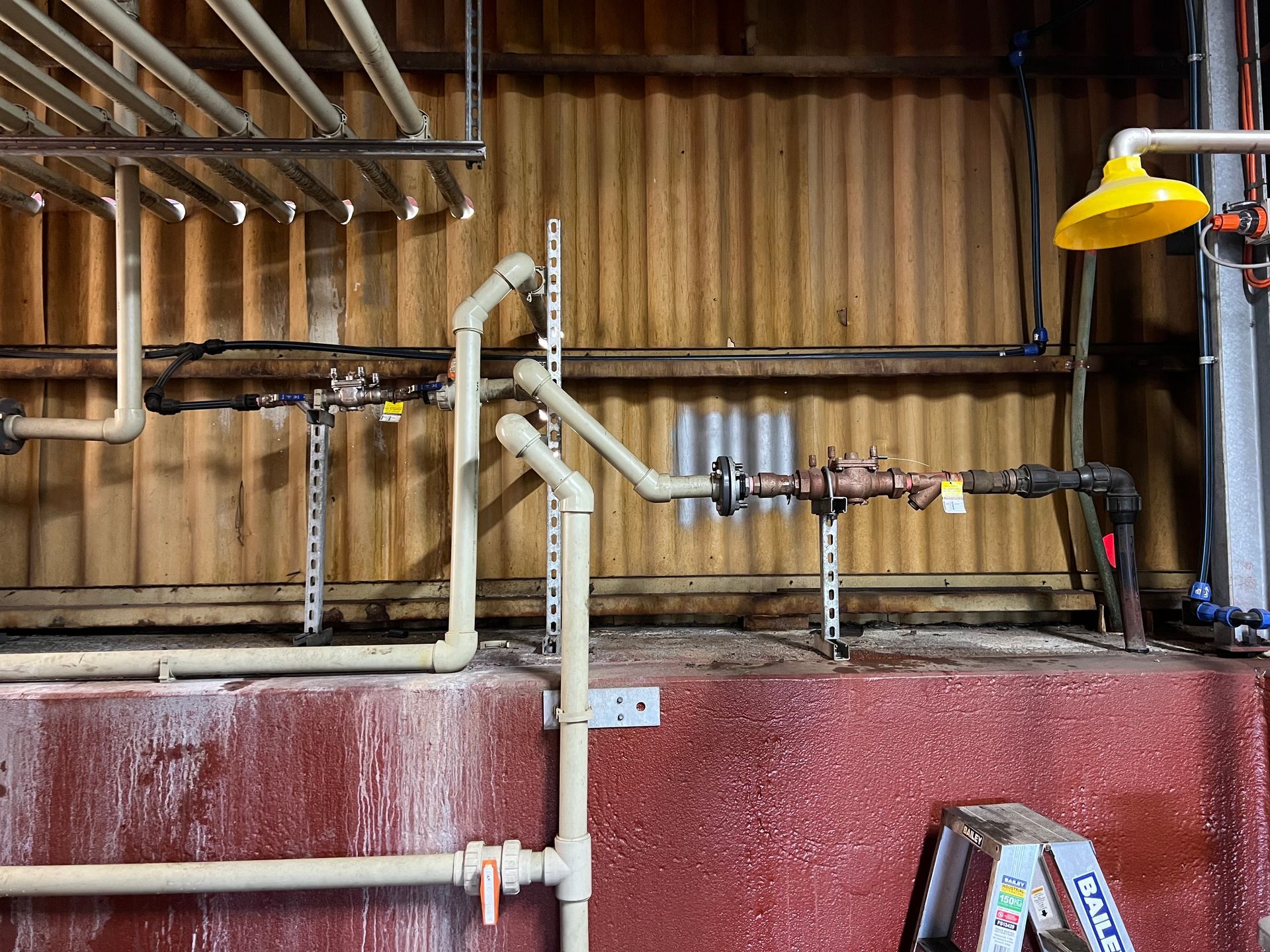 A Close Up of a Valve and Copper Pipes in a Machine — Simpson's Plumbing & Maintenance Service in Dakabin, QLD