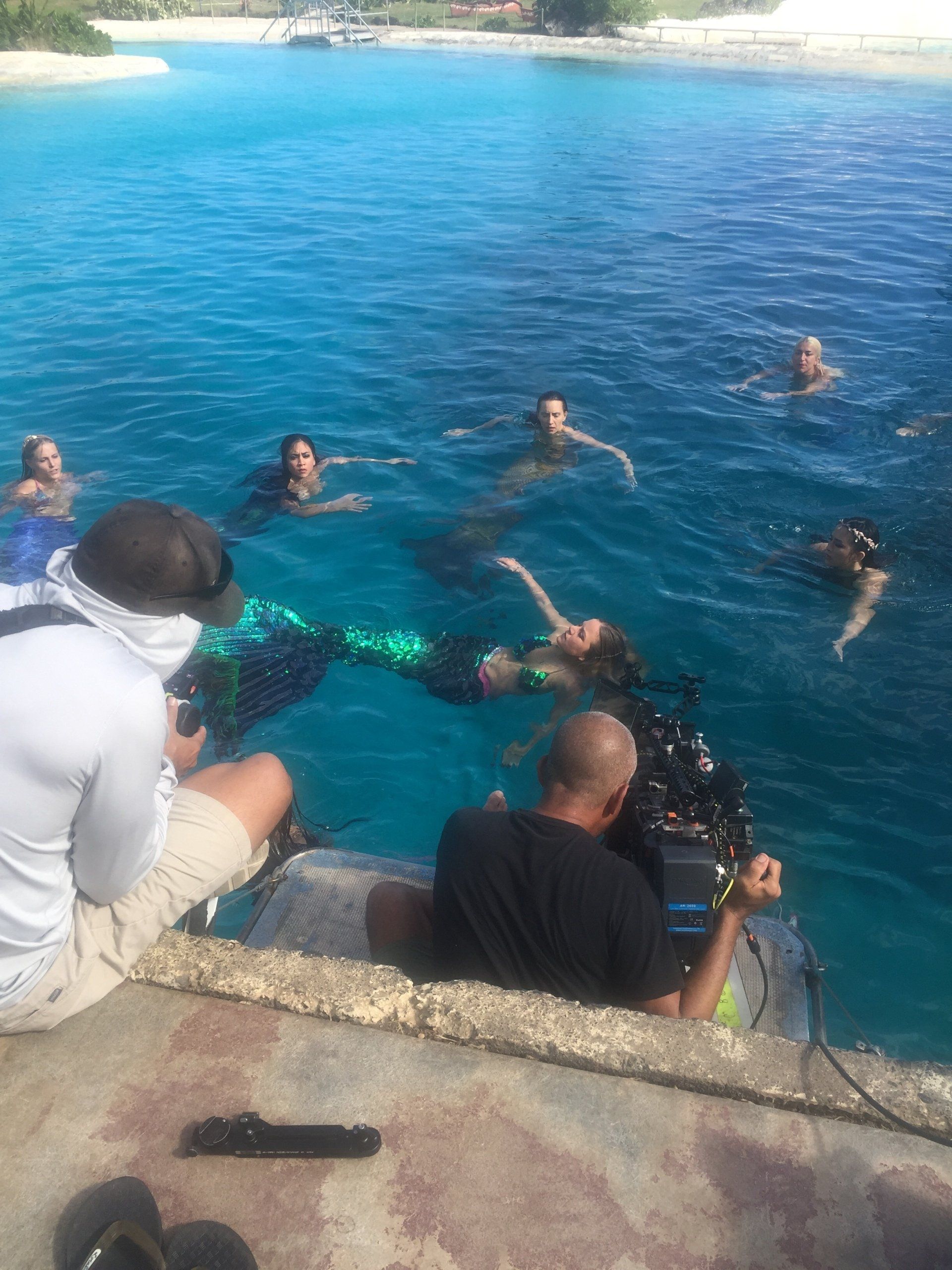 A group of people are swimming in the ocean.