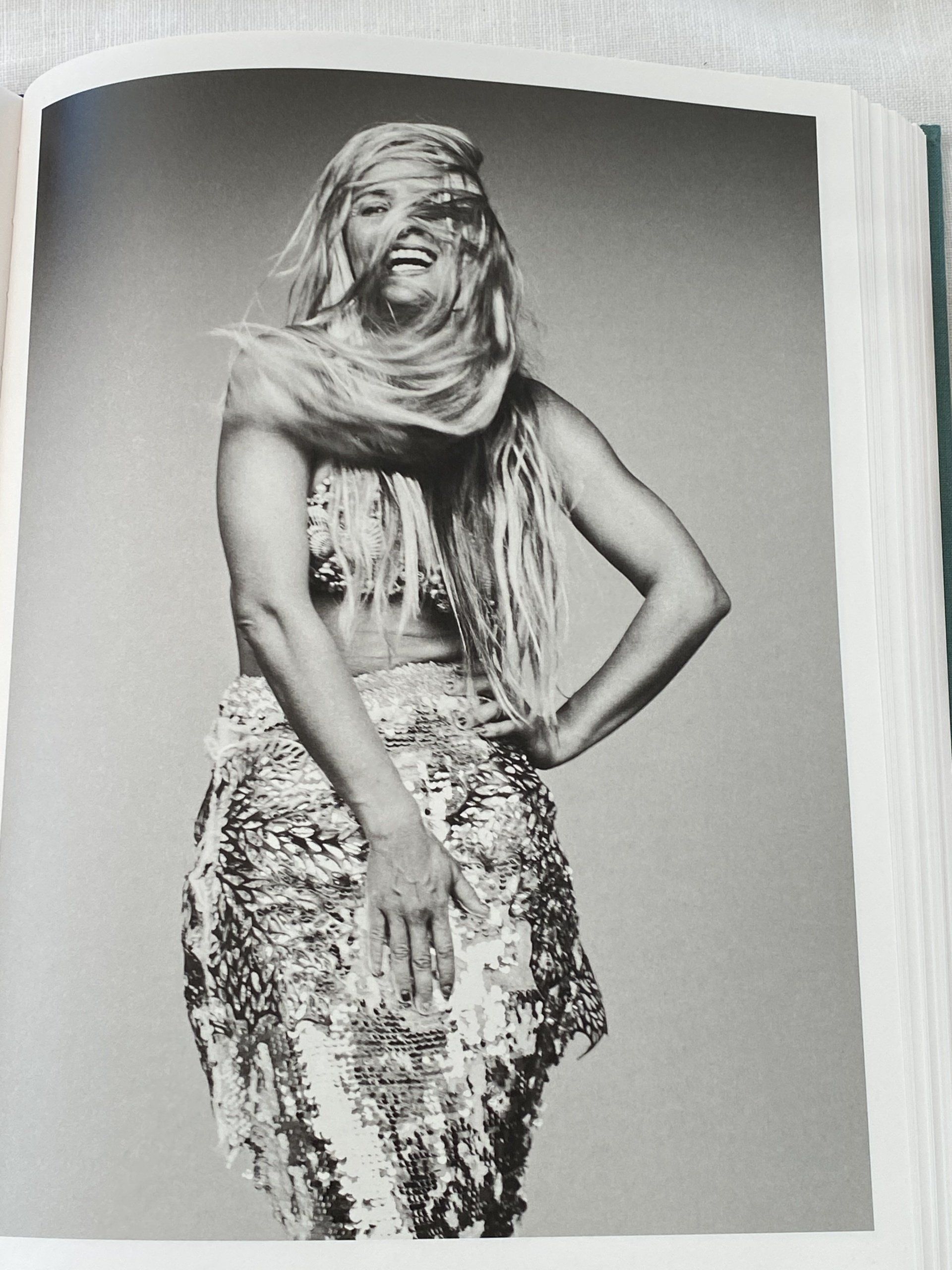 A black and white photo of a woman with long blonde hair