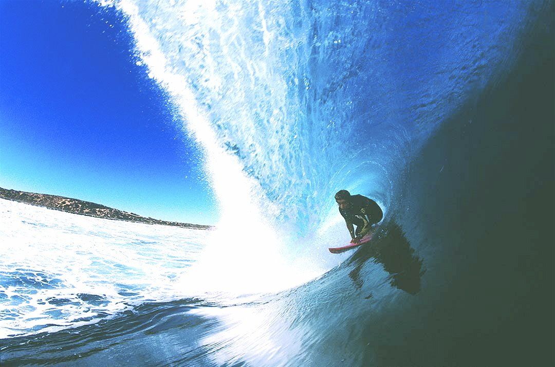 A surfer is riding a wave in the ocean.