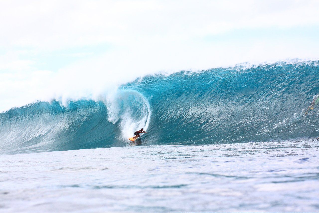 A surfer is riding a wave in the ocean.