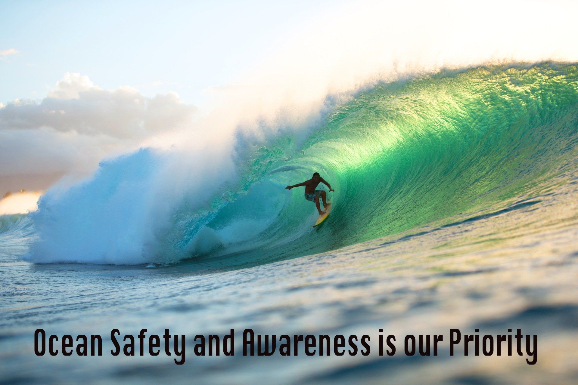 A man is riding a wave on a surfboard in the ocean.