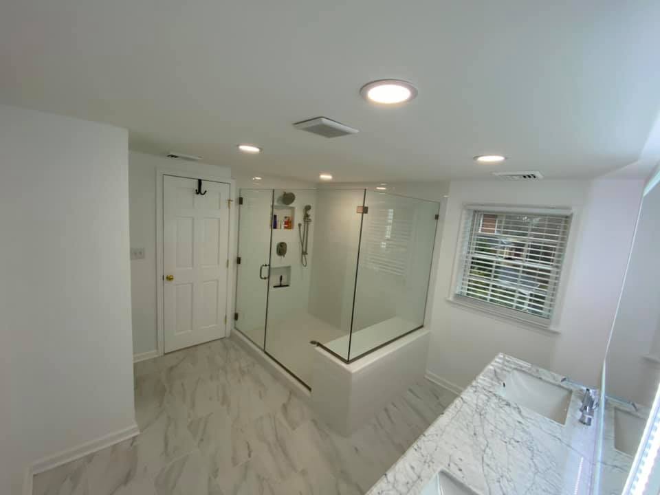 Contractor reviewing renovation permit documents with homeowner