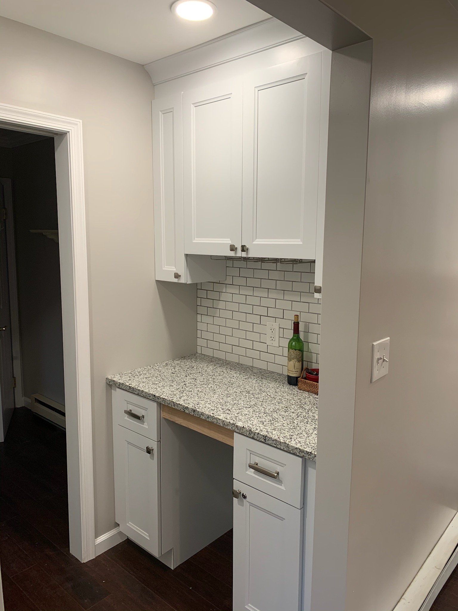 Mudroom bench and hooks in a garage entry renovation