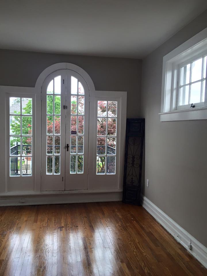 Contractor reviewing renovation plans with homeowners