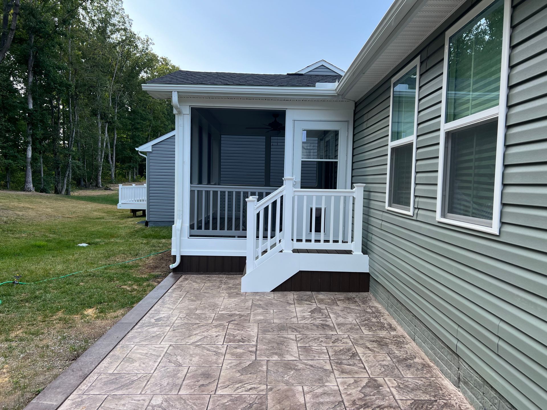 concrete patio with screened porch