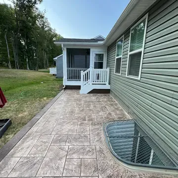 concrete stamped patio and screened porch