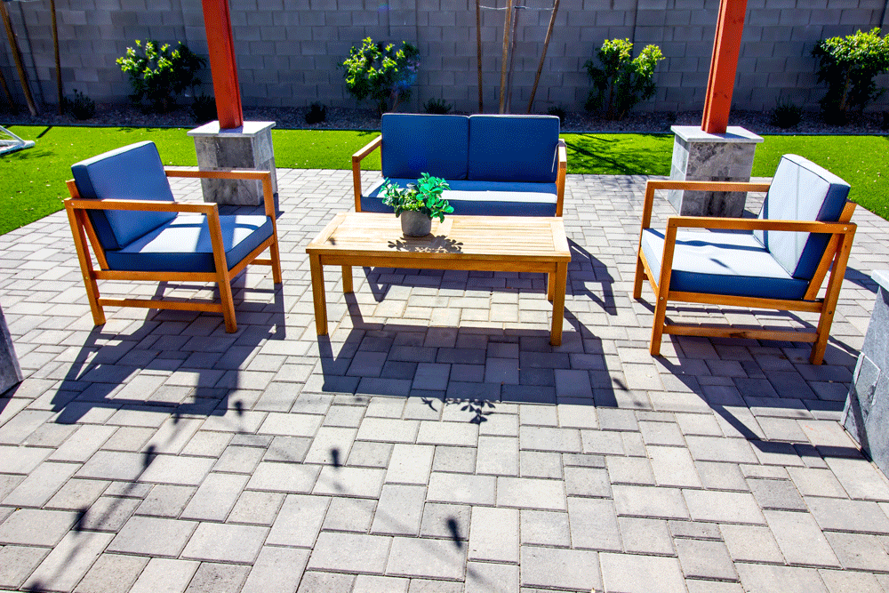 paver patio with chairs and table outside