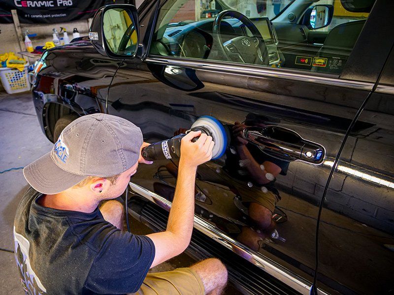 Man Cleaning Car Door — Lehigh Valley, PA — Pinnacle Luxury Car Care