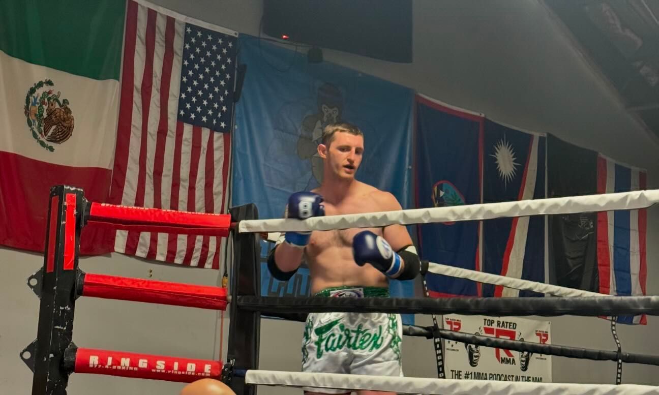 A man in a boxing ring with the word fairtex on his shorts