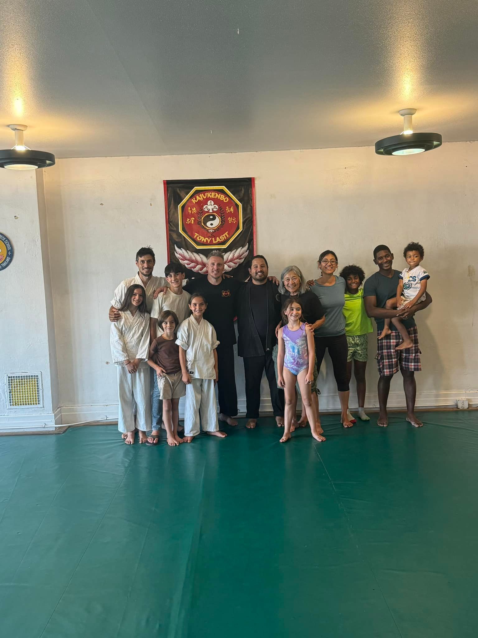 A person is holding a sparkler in their hand in the dark.