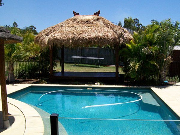 Bali Hut with Swimming Pool — Chipping Norton, NSW — Breeze Gazebos & Huts