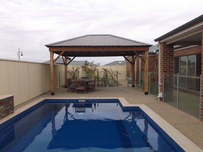 Colorbond Gazebo with Swimming Pool — Chipping Norton, NSW — Breeze Gazebos & Huts