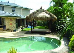 House with Bali Hut — Chipping Norton, NSW — Breeze Gazebos & Huts