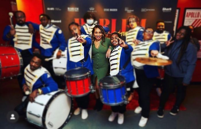 a group of marching band members are posing for a picture