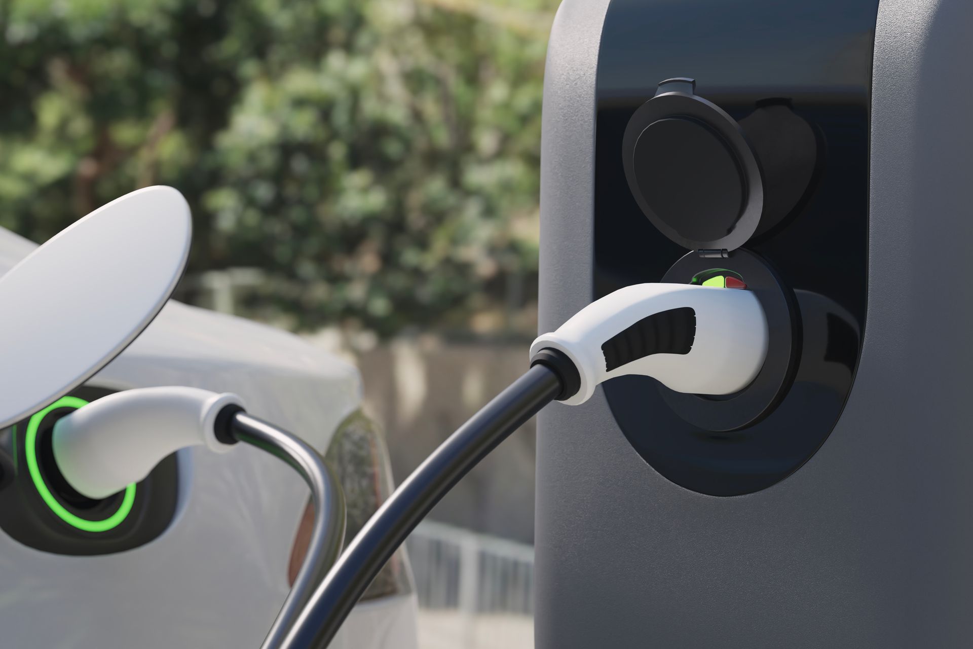 Electric vehicle charging station with two connected charging cables.